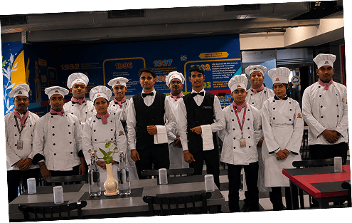 Students and faculty posing in a dining area