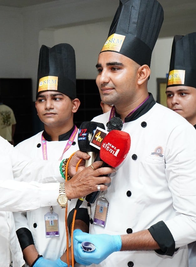 Waiter serving a guest in a hospitality training restaurant